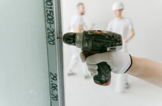 person holding a drill